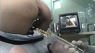 MILF Bound In A Machine And Takes An Enema In Her Ass
