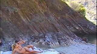Threesome fucking on the beach