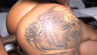 Ink-covered beauty’s round ass ripples as massive cock stretches her in intense fuck