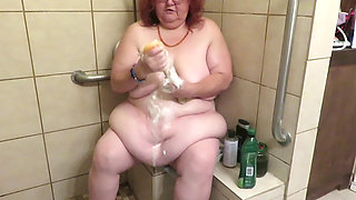 Step mom cleaning bathroom thinks of her step son watching