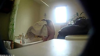 Adorable brunette with big tits takes a bath on hidden cam