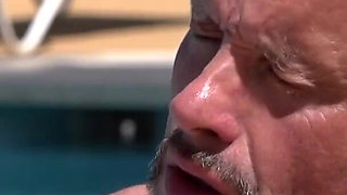 Colored hair babe is pleasing a hard cock with her feet