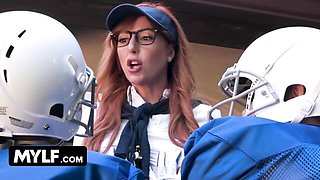 Redhead coach kneels for dual BJ in football locker room
