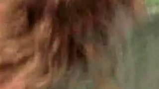 Curly-haired Babe Masturbates with Bottle in Hot Tub