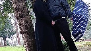 Muslim woman plays and blows a large cock outside in the park