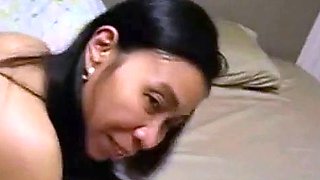 Amateur Thai in Stockings Blows and Rides a White Bull