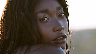 Petite Ebony MILF strips naked in a pool