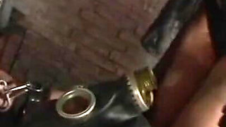 Humiliating man in gas mask