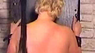 Mature Mistress Covers Her Bound Slave in Hot Wax