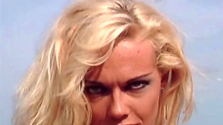 Lustful blonde Kelly Trump masturbates on rocks
