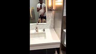 Sweet babe sucks and fucks black dick in public toilet