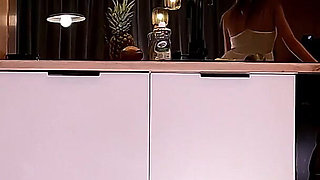 Hottest MILF Real Housewife in a Short Seethrough Sexy White Dress and with a G-string Does Not Cover Her Pussy in the Kitchen