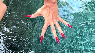 Long Red Nails and Long Fingers in Swimming Pool