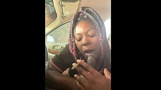 Amateur ebony MILF sucks off big black cock in the car