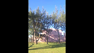 Stepmother in a Bikini in the Garden of the House Makes a Video for Her Stepson, to Show off Her New Clothes.