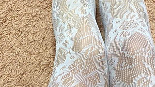 Rubbing my slim legs in hot stocking and heels