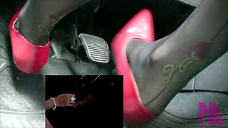 Driving in Scarlet Patent Pumps and Phillipe Matignone Rosed Stockings