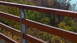 Slutty redhead gives a nice blowjob to an older guy outdoor and takes his cum in her mouth