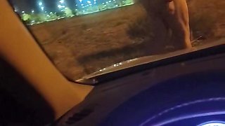 Naked outside the car
