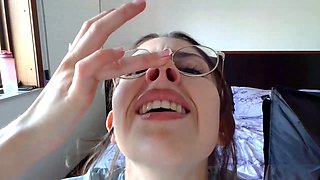 Smiley brunette teen in glasses showing off her petite body solo