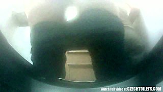 Two lustful Czech chicks pissing in the public toilet spy sex clip