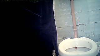 Pale skin chick in the public toilet room wipes her pussy with paper