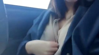 Asian girl masturbating in her car