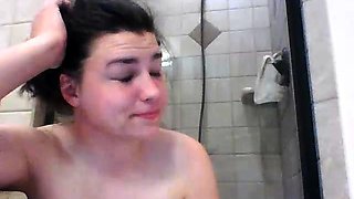 Chubby brunette girl pleases her aching cunt in the shower
