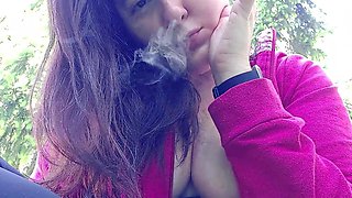 Nicoletta Smokes in a Garden and Shows You Her Big Tits by Pulling Them Out of Her Shirt