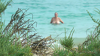 Watching on the beach as Isa has fun