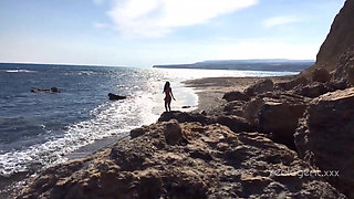 Alone lush Russian babe toys her cunt on the rock on the sea shore